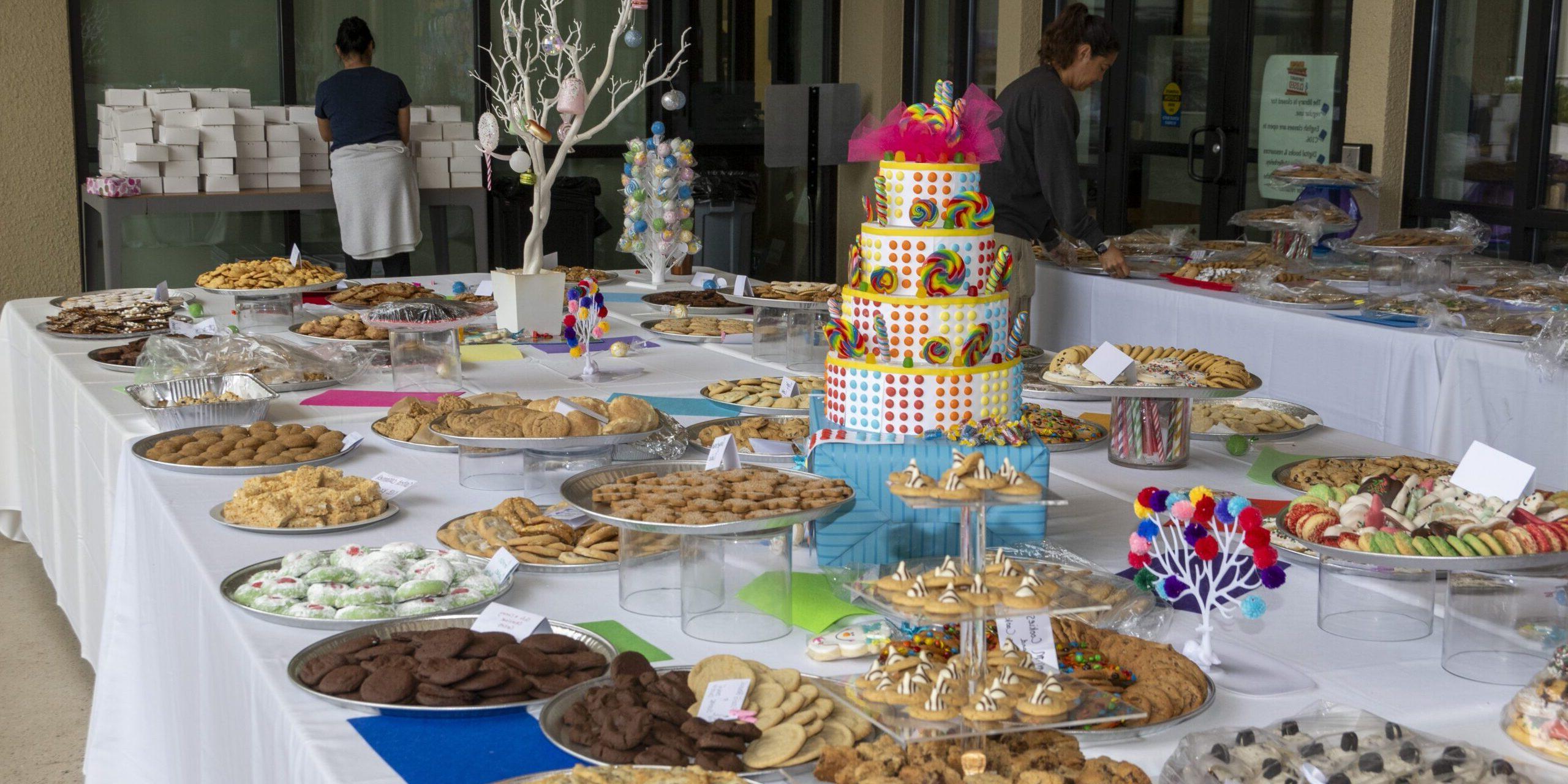 A photo of a table full of cookie platters.